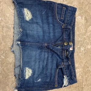 Mini distressed jean skirt